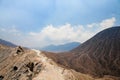 Beautiful mountain landscape. Part of the crater of the Bromo volcano. View from the top of the mountain. Blue sky and frozen lava Royalty Free Stock Photo