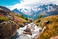 Beautiful mountain landscape with stream near Alps, Switzerland in the summer in blue sky Royalty Free Stock Photo