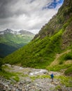 Beautiful mountain landscape with tourist hiking at Caucasus mountains