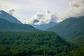 Beautiful mountain landscape with trees and clouds Royalty Free Stock Photo