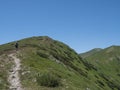 Beautiful mountain landscape of Western Tatra mountains or Rohace with men hiker with backpack hiking trail on ridge