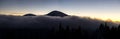 Beautiful mountain panorama of landscape with hazy peaks and foggy wooded valley at sunset Royalty Free Stock Photo