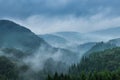 Beautiful mountain range covered with fog and rain in Yufuin, Oi