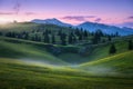 Beautiful mountain valley with green hills and meadows in fog Royalty Free Stock Photo