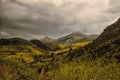 Unreal view on mountains with cloudy rain day