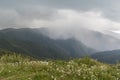 Beautiful mountain view with upcoming storm from the hills on the path to the Eho hut. Royalty Free Stock Photo