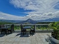 beautiful mountain views from the side of the table and chairs facing each other