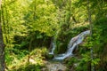 Beautiful mountain waterfall Gostilje in a green forest on natural park Zlatibor, Serbia in Europe on a sunny summer day