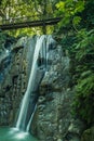 Beautiful mountain waterfall, milky water, in the tropical jungle on a sunny day