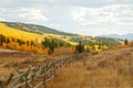 Beautiful mountainous landscape with autumn colors under a breathtaking cloudy sky Royalty Free Stock Photo