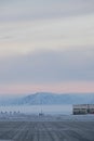 Beautiful mountains covered in snow  in winter and gleaming under the cloudy colorful sky Royalty Free Stock Photo