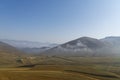 Beautiful mountains landscape, fluffy clouds descended to the mountain tops.