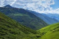 Beautiful mountains ranges. Mountain landscape on summer sunny day with white clouds in blue sky. Scenery nature of wild Svaneti Royalty Free Stock Photo