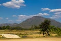 Beautiful mountains, rice straw in the fields, white cloud and blue sky background Royalty Free Stock Photo