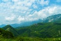 beautiful mountains, summer landscape, clouds, forest on the hillsides