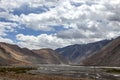 Beautiful mountains and winding streams under the blue sky and white clouds