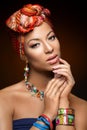 Beautiful mulatto young woman with turban on head Royalty Free Stock Photo