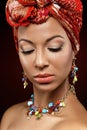 Beautiful mulatto young woman with turban on head Royalty Free Stock Photo