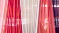 Beautiful multi-colored curtains decorated as a backdrop for the Buddhist ceremonies in Southeast Asia. Fabric colour and texture