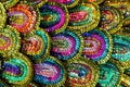 Beautiful multi-colored sequins shimmering in the light in the form of a peacock tail. Abstract background.