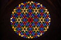 Beautiful multi colored stained glass rose window with flower prints