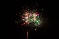 Beautiful multicolored firework isolated on black background