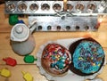 Beautiful multicolored Hanukkah donuts. Pastry decoration on donuts. Chanukia, Sevivon, Dreidl. Royalty Free Stock Photo