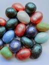 beautiful multicolored nut candy in chocolate colored glaze Royalty Free Stock Photo
