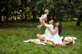 Beautiful mum, dad and their cute little child have fun together and smiles outside Royalty Free Stock Photo