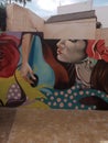 beautiful mural of a woman playing flamenco guitar in the Jewish quarter of the Spanish city of Malaga on a summer day