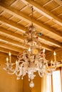 Beautiful Murano glass crystal chandelier, under a wooden ceiling. Royalty Free Stock Photo