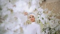 Beautiful muslim bride in white wedding dress and bridal headdress Royalty Free Stock Photo