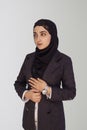 Beautiful Muslim businesswoman in hijab against white background. Portrait of pretty middle-eastern female wearing traditional Royalty Free Stock Photo