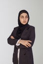 Beautiful Muslim businesswoman in hijab against white background. Portrait of pretty middle-eastern female wearing traditional Royalty Free Stock Photo