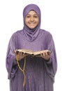 Beautiful Muslim Girl in Islamic Fashion Dress Holding Holy Book of Quran With Happy Smily Face