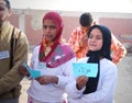 Beautiful Muslim girls holding up arabic words Royalty Free Stock Photo