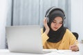 Beautiful muslim student girl using a laptop computer learning online at home. Distance learning online education Royalty Free Stock Photo