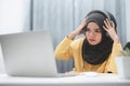 Beautiful muslim student girl using a laptop computer learning online at home. Distance learning online education Royalty Free Stock Photo