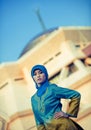 Beautiful muslim woman in front of mosque