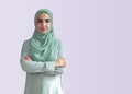 Beautiful Muslim woman in hijab against bright background. Portrait of pretty middle-eastern female wearing traditional Islamic Royalty Free Stock Photo