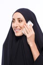 Beautiful Muslim woman holding a cellphone