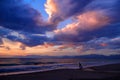 Beautiful mysterious dramatic romantic colorful sun dusk sunset on Ionian Sea on sand beach. Child and father parents. Twilight gl