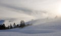 Beautiful and mysterious winter mountain landscape with a cabin and fence in the fog in deep snow Royalty Free Stock Photo