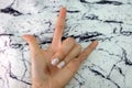 Beautiful Nail Polish, Manicure Nail. Close Up Granite Gray Nails on the Granite Stone Fabric Royalty Free Stock Photo