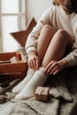 naked female legs in white socks girl sitting on the bed Royalty Free Stock Photo