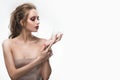 Beautiful naked shoulders girl holds a seashell in her hand. Healthy clean skin. Royalty Free Stock Photo