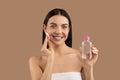 beautiful naked woman using micellar water and cotton pad Royalty Free Stock Photo