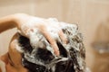 Beautiful naked young woman taking shower in bathroom. Royalty Free Stock Photo