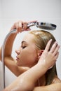 Beautiful naked young woman taking shower in bathroom Royalty Free Stock Photo