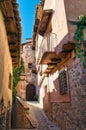 Beautiful narrow and ramp medieval street in the town of Albarracin, Teruel, Spain Royalty Free Stock Photo